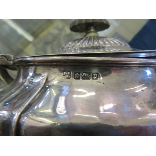 45 - A silver teapot with wooden finial hallmarked Sheffield by Pearce & Sons Ltd, Leeds, York and Leices... 