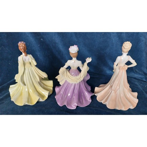 Three Coalport figurines from the Flower Lady Collection being