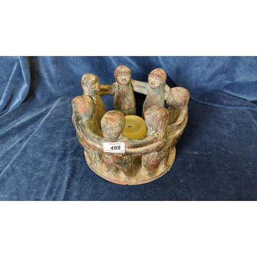 499 - An unusual terracotta 'circle of friends' candle holder.