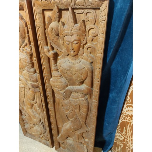 10 - A pair of carved hardwood panels depicting Asian Female Goddesses.