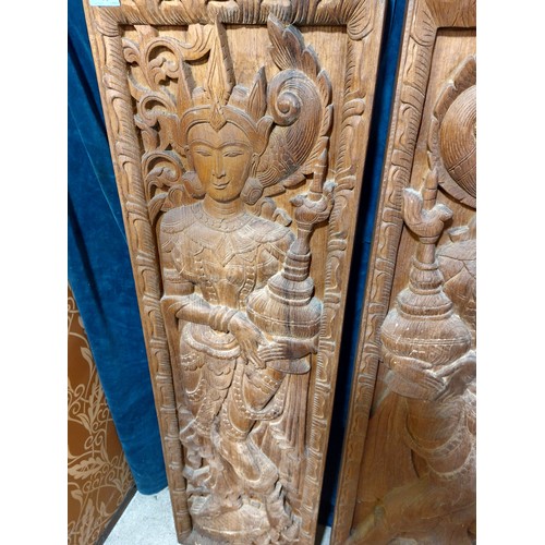 10 - A pair of carved hardwood panels depicting Asian Female Goddesses.