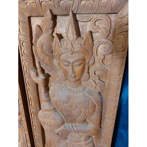 10 - A pair of carved hardwood panels depicting Asian Female Goddesses.