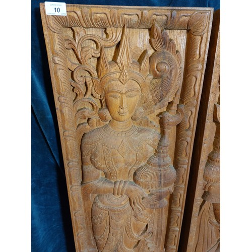 10 - A pair of carved hardwood panels depicting Asian Female Goddesses.