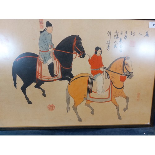 33 - A framed Oriental print depicting woman and attendant on horse back.