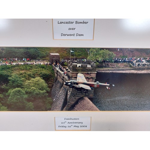 43 - A framed coloured photograph print depicting 'Lancaster Bomber over Derwent Dam' for the Dambusters ... 