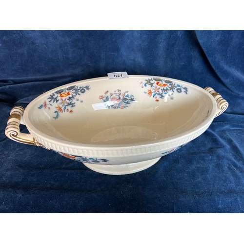 621 - An oval open dish with scroll handles and floral design.