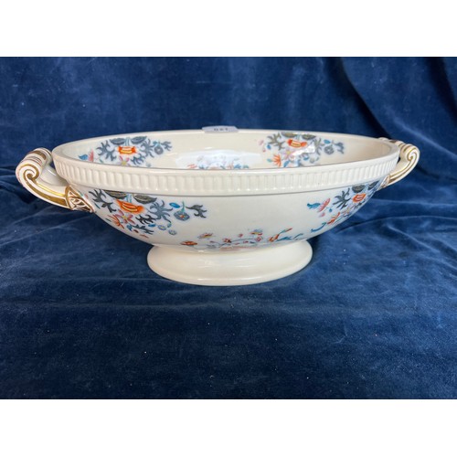 621 - An oval open dish with scroll handles and floral design.