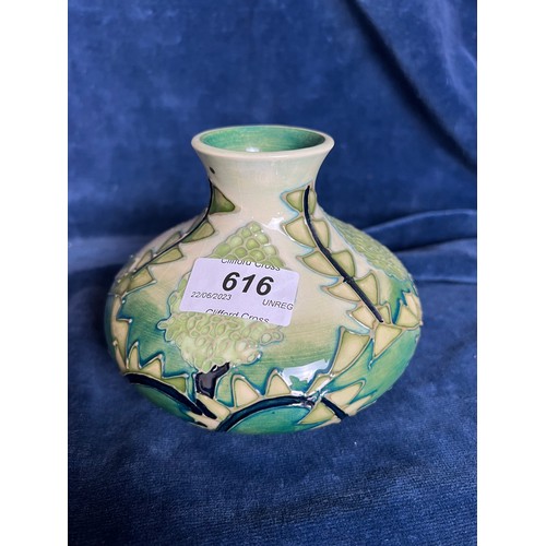 616 - A Moorcroft small vase having green stylised design.