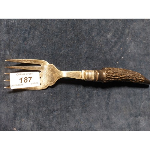 187 - A carving set having horn style handles, with silver banding hallmarked Sheffield, together with a t... 