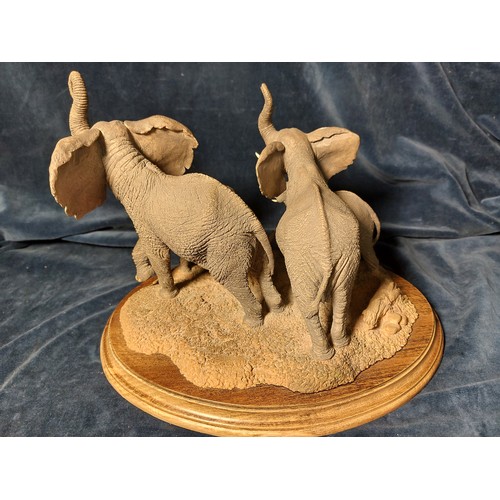 197 - A Country Artists figurine depicting a herd of elephants 