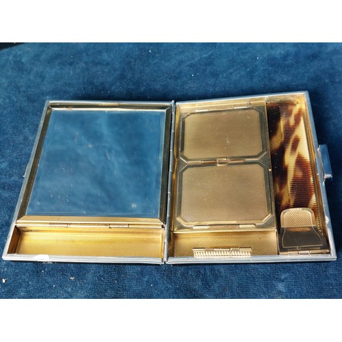 242 - An Art Deco style ladies compact/cigarette case with comb with original central Jade inset, in origi... 