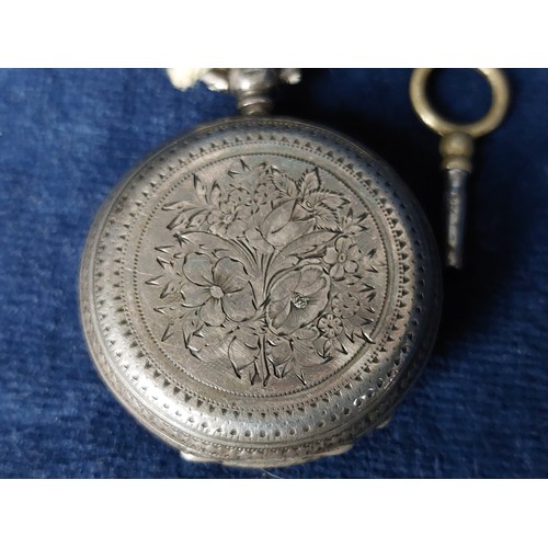 247 - A silver cased pocket watch having engine turned decoration and winder by Kendal & Kent, hallmarked ... 