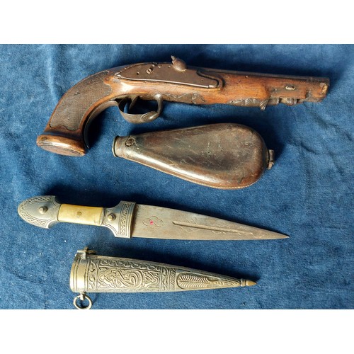 265 - An antique muzzleloader with carved detail and metal mounts A/F, together with a leather pouch havin... 