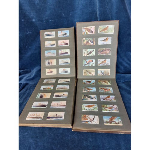 282 - A mid 20th century cigarette  card album containing approximately 260 cigarette cards including Line... 