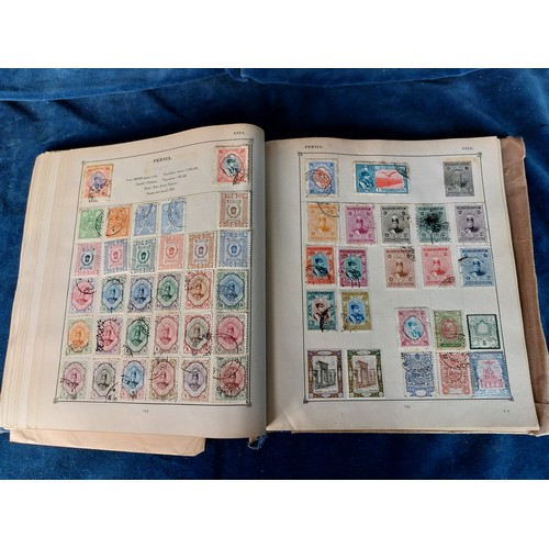 283 - A Strand Stand Album containing a quantity of early and mid 20th century postage stamps from around ... 