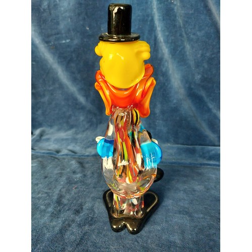 301 - An End of Day coloured glass clown figure.