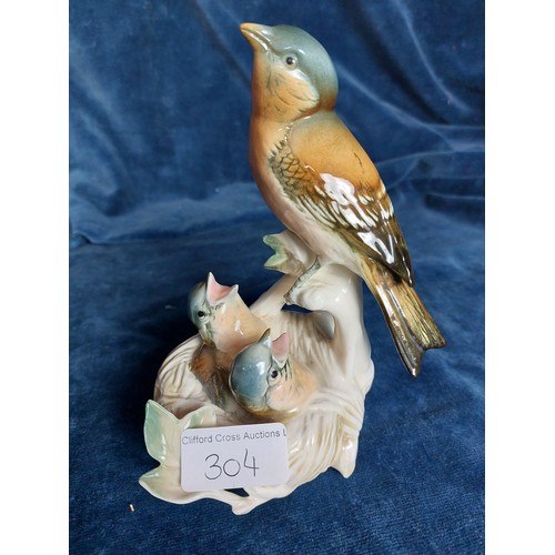 304 - Two German porcelain figures of birds designed by Karl Ens depicting Kingfishers and a bird with a n... 