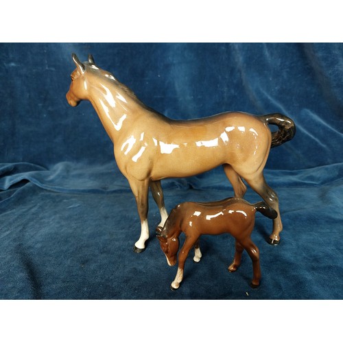 308 - Two Beswick figurines depicting Horse and Foal.