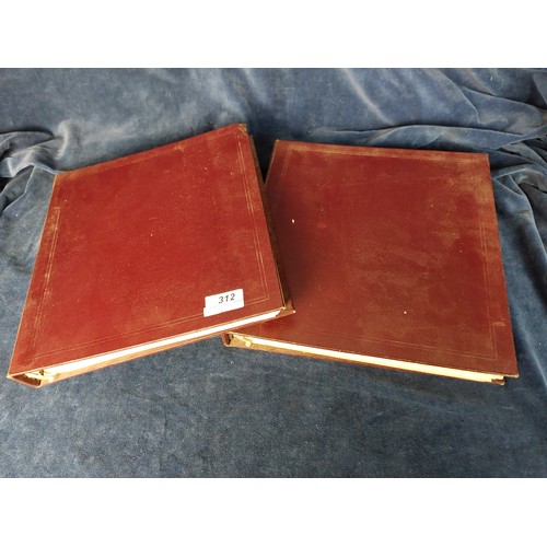 312 - Two maroon folders containing a quantity of stamps from around the world.