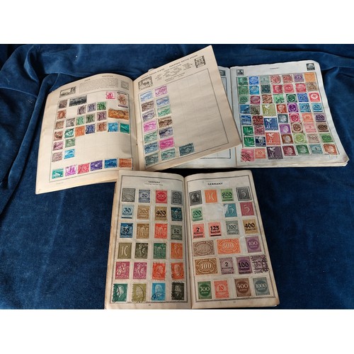 315 - Three stamp albums containing stamps from around the world.