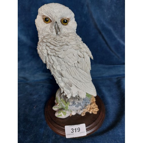 319 - A Country Artists figure 'Snowy Owl', CA399, on wooden base.