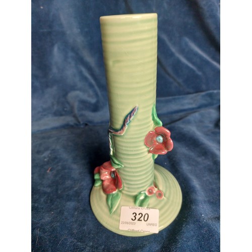 320 - A Clarice Clifff posy vase with green ground and applied floral decoration.