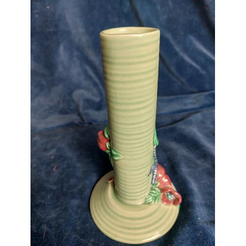 320 - A Clarice Clifff posy vase with green ground and applied floral decoration.