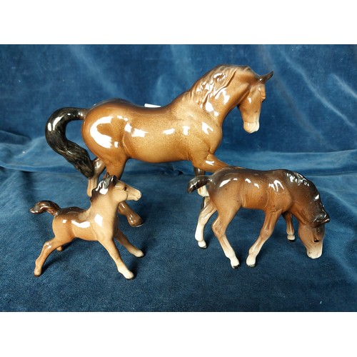 326 - Three Beswick horse figurines depicting 'Horse and 2 Foals'.