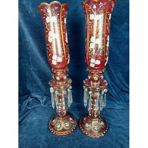 351 - A pair of Baccarat style antique candlesticks with hurricane shades, accented with hand-painted whit... 