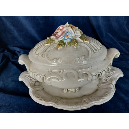 362 - A Capodimonte style lidded tureen and platter having applied floral decoration.