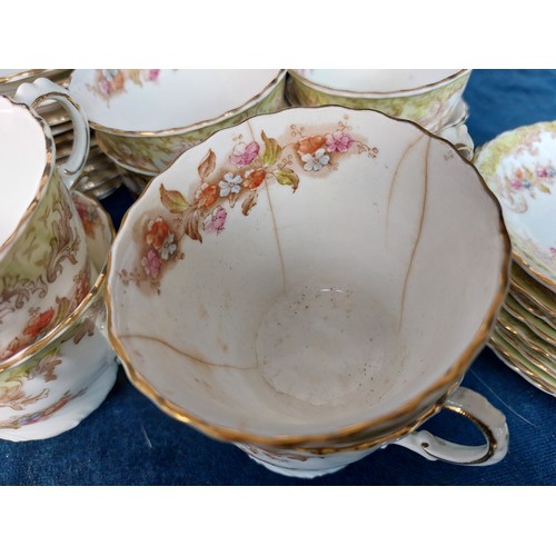 364 - An unmarked part China tea set having floral decoration comprising 8 tea cups, 8 saucers, 12 side pl... 