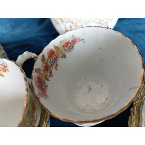 364 - An unmarked part China tea set having floral decoration comprising 8 tea cups, 8 saucers, 12 side pl... 