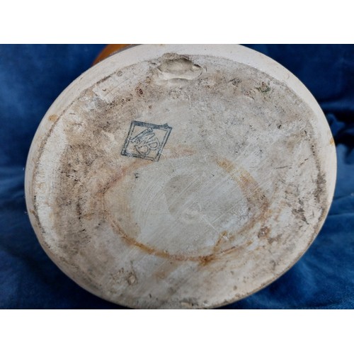 367 - A 2-tone stoneware pot having 2 applied handles and a hand-made wooden lid.