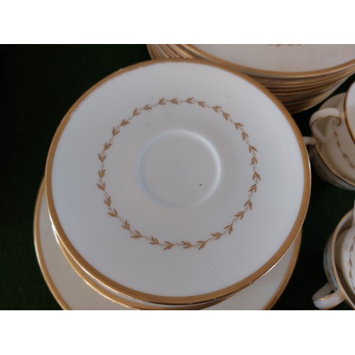 373 - A Royal Doulton 'Covington' pattern dinnerware comprising plates and cups.