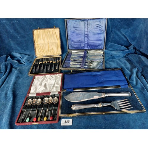 385 - Four presentation cases of cutlery including 6 coffee spoons with coffee bean finials, fish knives a... 