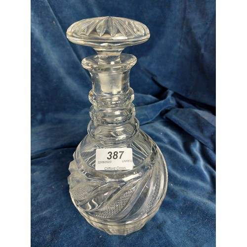 387 - Two cut glass decanters.