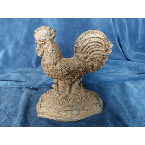 390 - A cast doorstop in the shape of a cockerel, together with a carved gavel.