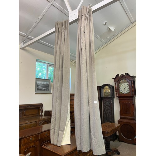 774 - A pair of taupe-lined curtains.