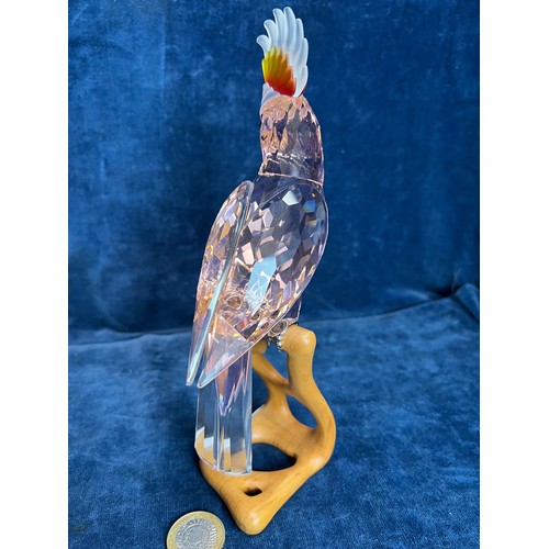 539 - A Swarovski Crystal figure of a pink Cockatoo.