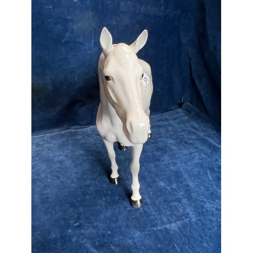 529 - A large Beswick figure of a Dapple-grey Stallion.