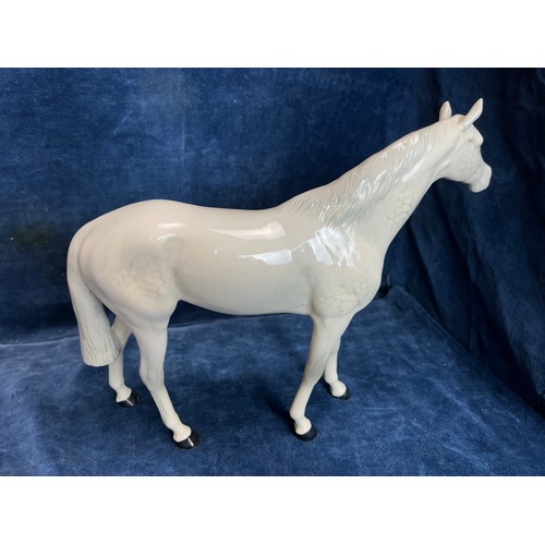 529 - A large Beswick figure of a Dapple-grey Stallion.