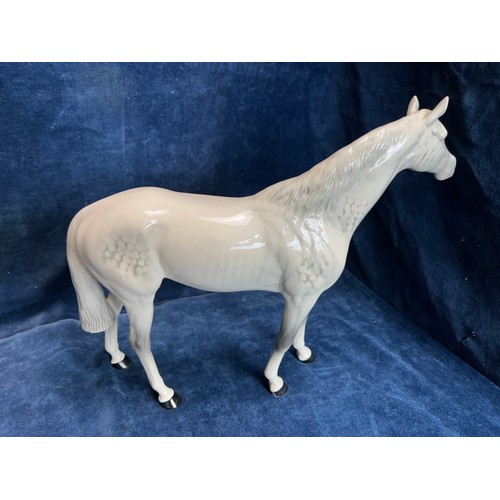 528 - A large Beswick figure of a Dapple-grey Stallion.