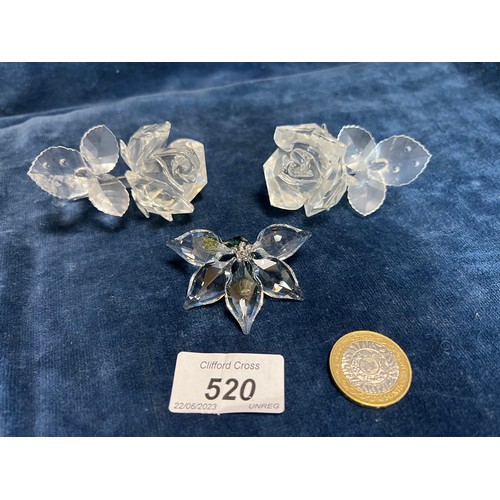 520 - Three Swarovski Crystal floral ornaments.