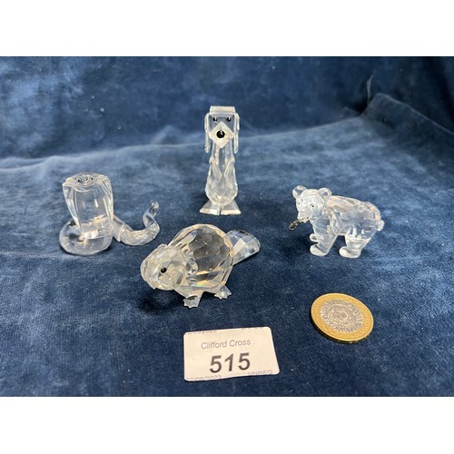 515 - Four Swarovski Crystal figures being a Bear, Dog, Beaver and a Cobra.