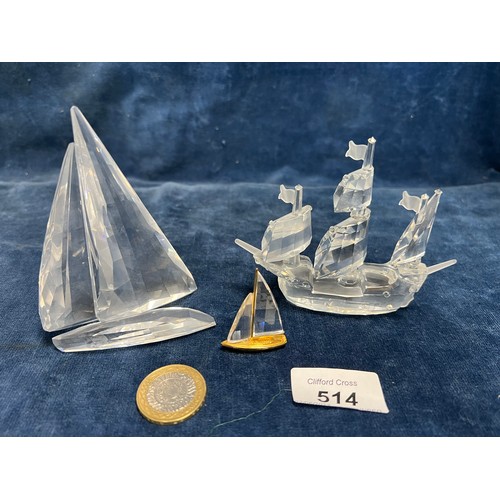 514 - Three Swarovski Crystal figures being a Sailing Ship and 2 boats.