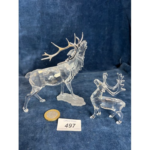 497 - Two Swarovski Crystal figures of Stags.