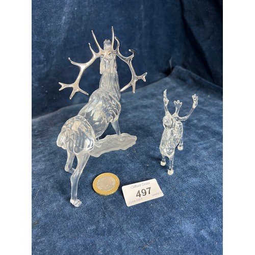 497 - Two Swarovski Crystal figures of Stags.