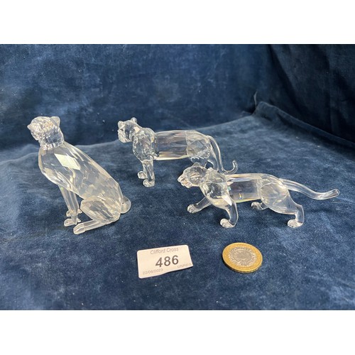 486 - Three Swarovski Crystal figure of various Big Cats.