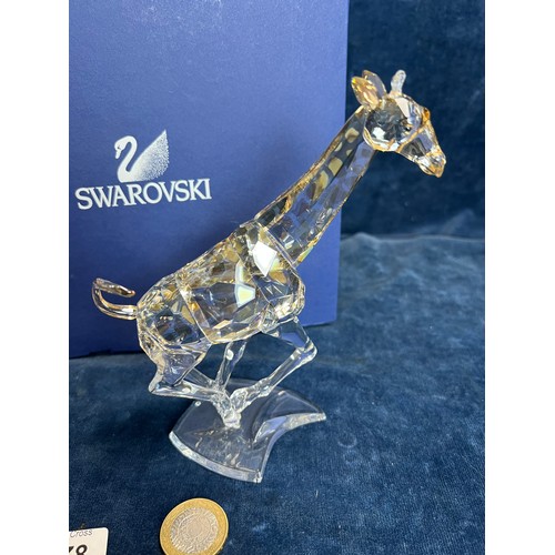 478 - A Swarovski Crystal figure of 'A Giraffe' with original box.