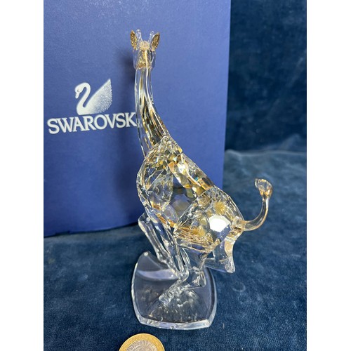 478 - A Swarovski Crystal figure of 'A Giraffe' with original box.